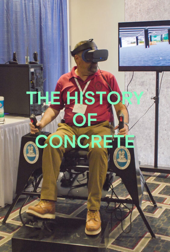 The History of Concrete En mann med VR briller sitter i en stol med kontrollspaker En skjerm viser et digitalt miljø Bak er et blått forheng og et bord med utstyr